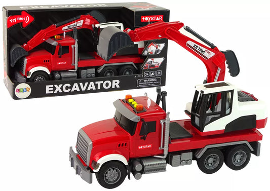 Sunkvežimis su ekskavatoriumi ir šviesomis