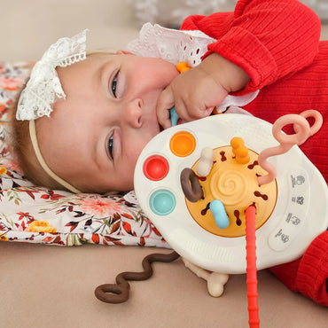 „WOOPIE BABY“ Montessori sensorinis žaislas – kramtukas, barškučiai ir daugiafunkcis „UFO“ žaislas