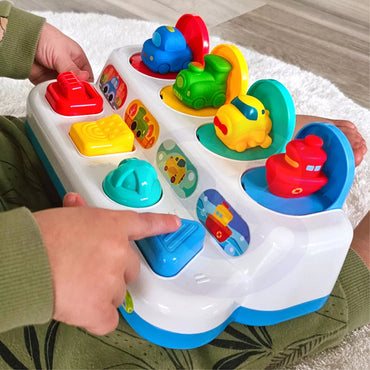 WOOPIE BABY edukacinis žaislas „Pop-Up“ transporto priemonės