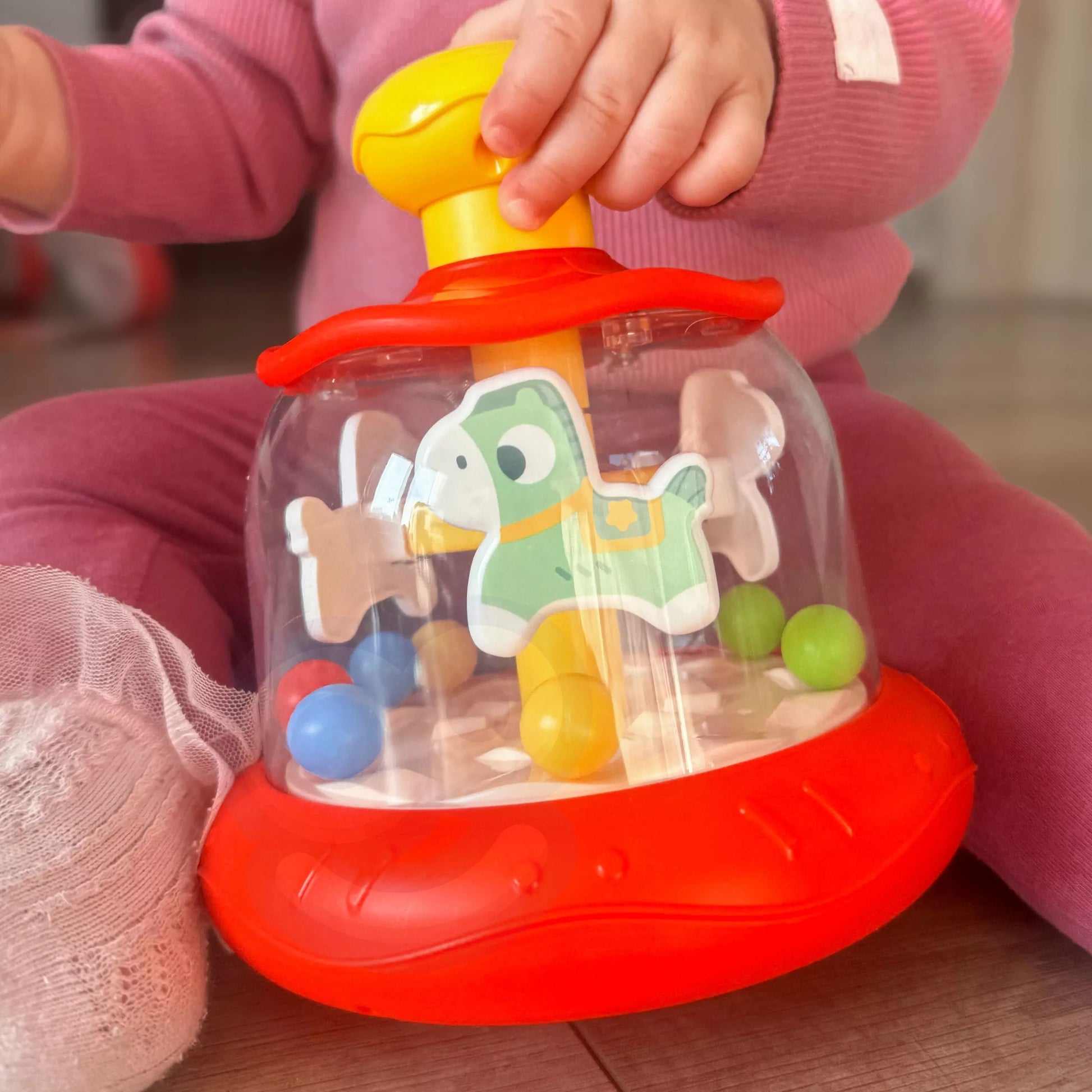 WOOPIE BABY spalvingų arkliukų raudona besisukanti karuselė (vilkelis)
