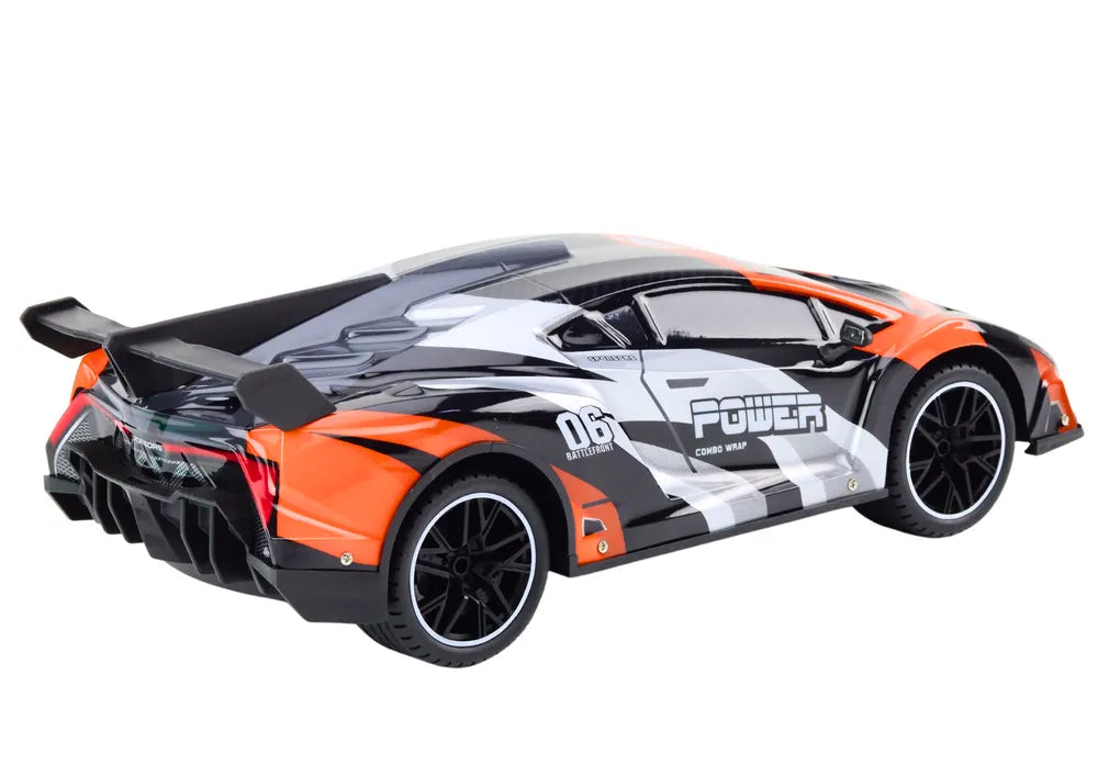 R/C sportinis automobilis 1:10 – pilkas ir oranžinis, iki 25 km/val.